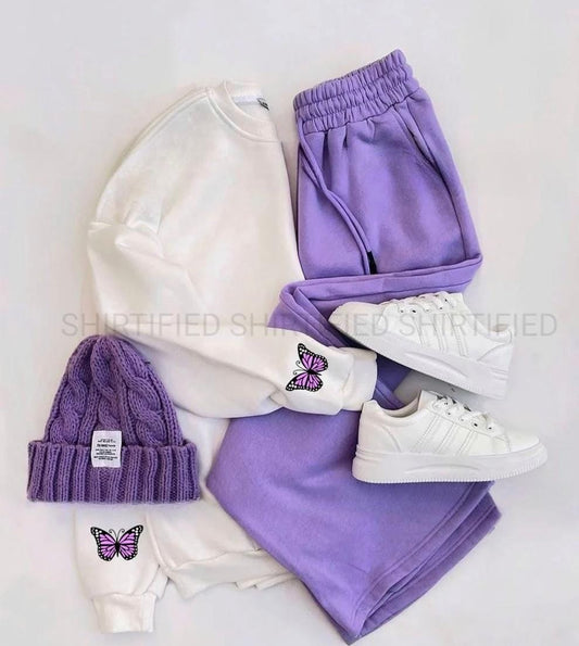 white sweatshirt purple titli on arma with lilac flapper plain