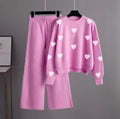 pink tracksuit with (white hearts all over)
