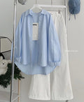 skyblue button down shirt with white wideleg jeans