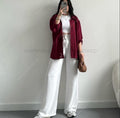 maroon button down shirt with white wideleg jeans