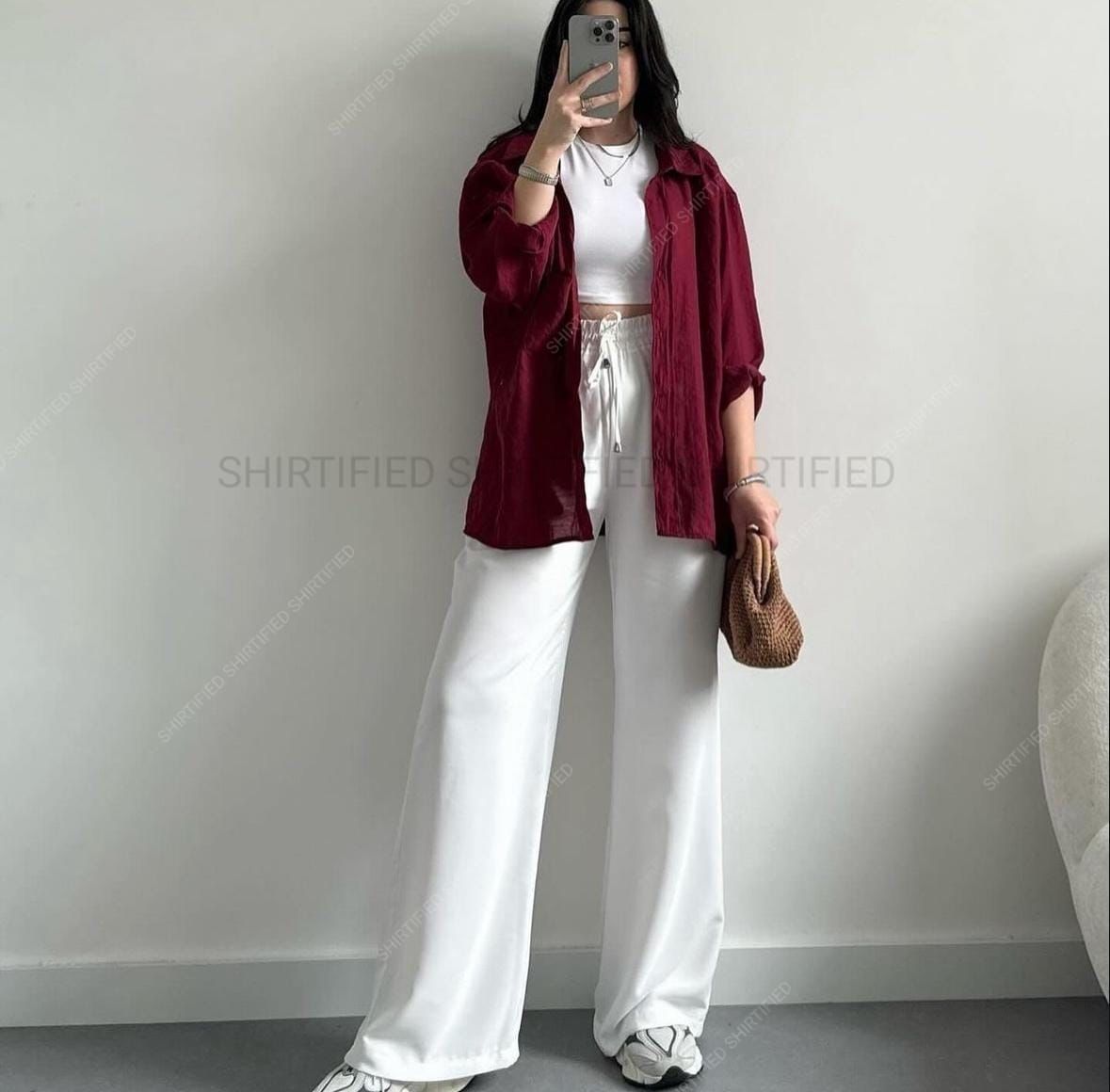 maroon button down shirt with white wideleg jeans