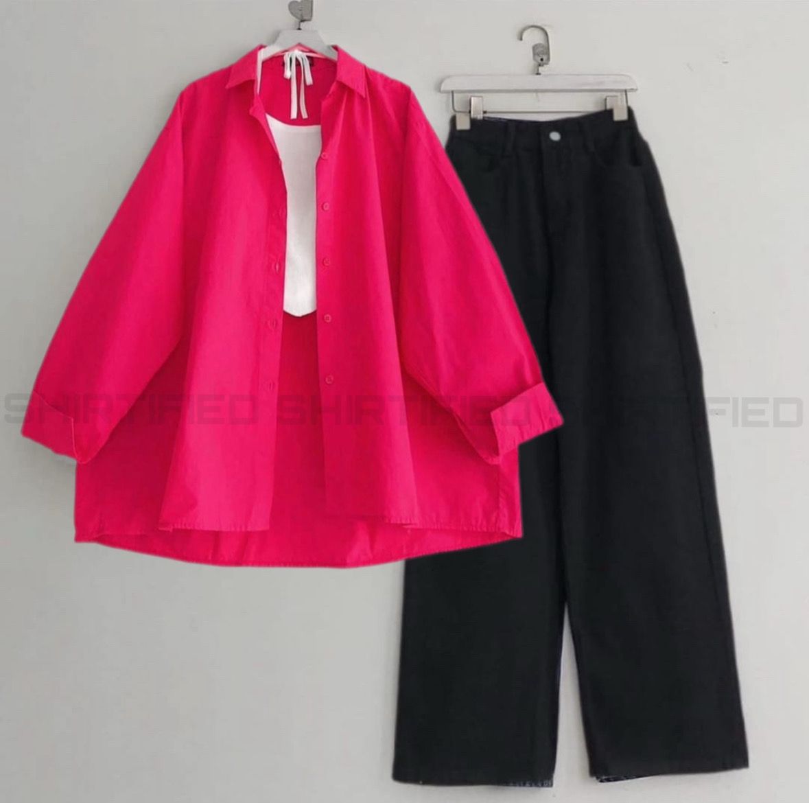 shocking pink button down shirt with black wideleg jeans